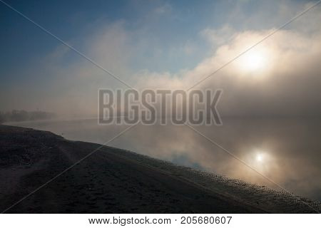 Morning on the river early morning reeds mist fog and water surface on the river
