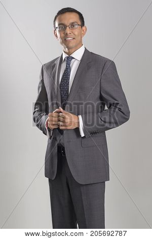 Portrait Of Man In Business Attire Twiddling Thumbs