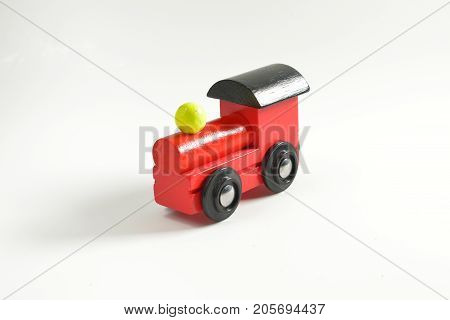 Wooden toy train with colorful blocs isolated on white background.