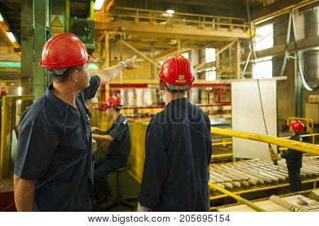 Padaeng industry Mae Sot Tak Thailand February20 2013 : Zinc mine. Engineer consult about work.