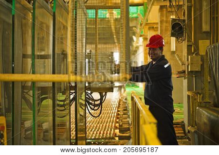 Padaeng industry Mae Sot Tak Thailand February20 2013 : Zinc mine. engineer control machine in factory.