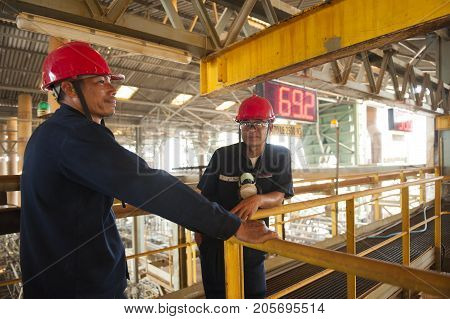 Padaeng industry Mae Sot Tak Thailand February20 2013 : Zinc mine. engineer consult about work.