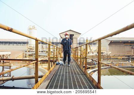 Padaeng industry Mae Sot Tak Thailand February20 2013 : Zinc mine. Engineer walking in walkway.
