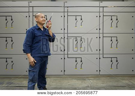 Padaeng industry Mae Sot Tak Thailand February20 2013 : Zinc mine. Engineer communicate through walkie talkie.