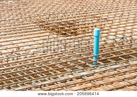 Reinforcement metal framework and pipe system for drainage under flooring for concrete pouring. Ready for filling up with concrete.