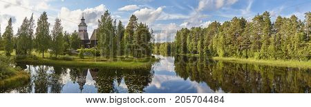 Finland landscape with forest and lake. Petajavesi church. Finnish heritage