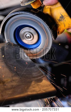Cutting Steel With Angle Grinder At Car Service