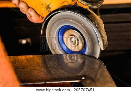 Cutting Steel With Angle Grinder At Car Service