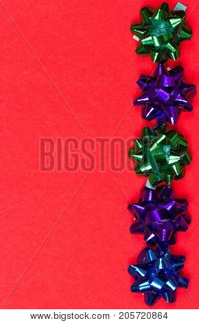 Bows for anniversary decoration on red background