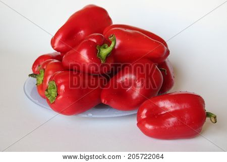 bright red paprika lies on a large plate