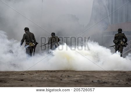 Gryfino Poland 23 september 2017: Historical reconstruction of the battle at Arnhem German soldiers in a cloud of smoke.