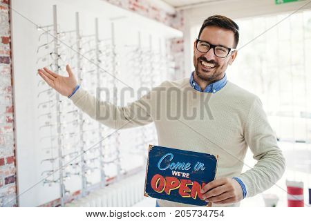 Handsome Man Saleperson In Optics Store