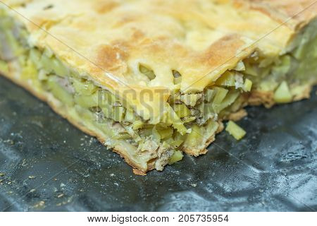potato pie with minced meat on a baking sheet from the oven freshly baked