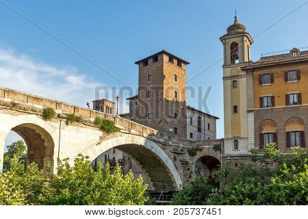 ROME, ITALY - JUNE 22, 2017: Amazing view of Castello Caetani, Tiber River and Pons Fabricius in city of Rome, Italy