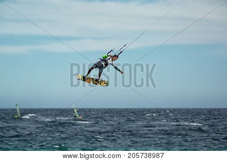 January 25 2014 Los Barriles Mexico: kiteboarder lifts off from water at the 'Lord of the Wind' kite surf competition