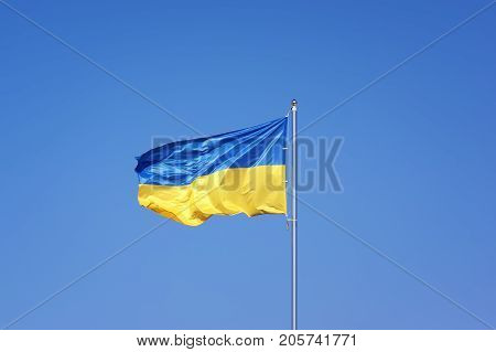 Ukrainian flag on blue sky backgroud. Ukraine flag