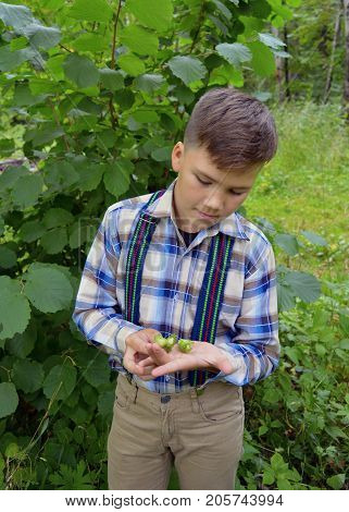 gay boy with nuts in a green forest
