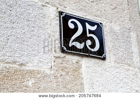 house number twenty-five 25 on the wall
