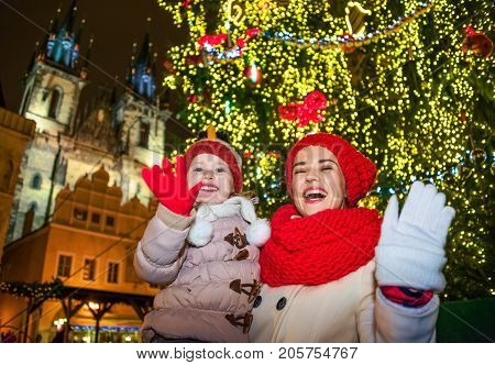 Mother And Daughter Travellers In Christmas Prague Handwaving