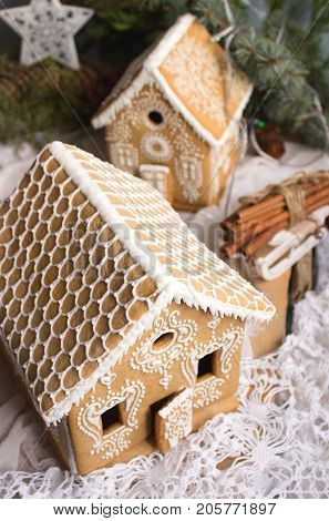 Gingerbread houses decorated with icing. Festive decor. Selective focus.