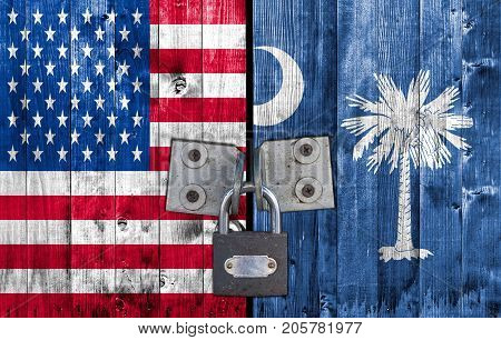 US and South Carolina flag on door with padlock