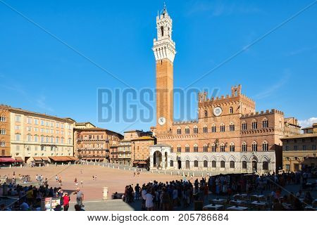 SIENA,ITALY - JULY 23,2017 : Piazza del Campo next to the Palazzo Publico on the medieval city of Siena in Tuscany