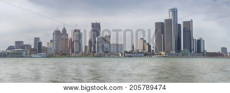 WINDSOR, ONTARIO - APRIL 8, 2017: Panoramic view of skyline at downtown Detroit with the General Motors Renaissance Center in the background.