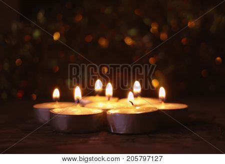 Burning Candles On Christmas Decoration Background. Festive Composition.