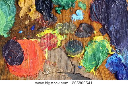 Mix of oil paints on handmade wooden palette.