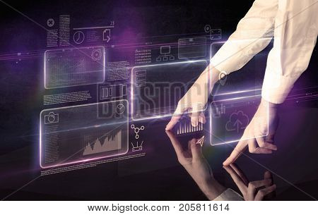 Male hands touching interactive table with purple cloudspace graphic on it 