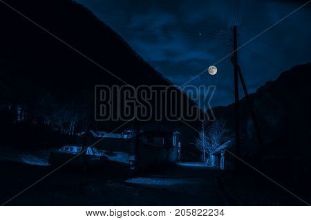 Mountain River With Stones And Grass In The Forest At The Foot Of Mountain Slope At Night In Moon Li
