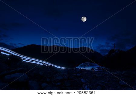 Mountain River With Stones And Grass In The Forest At The Foot Of Mountain Slope At Night In Moon Li