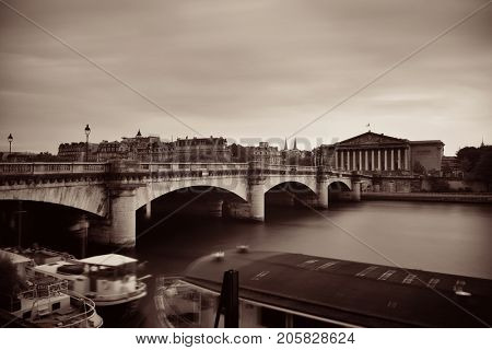 Paris River Seine with Pont de la Concorde and Assemblee Nationale at sunset