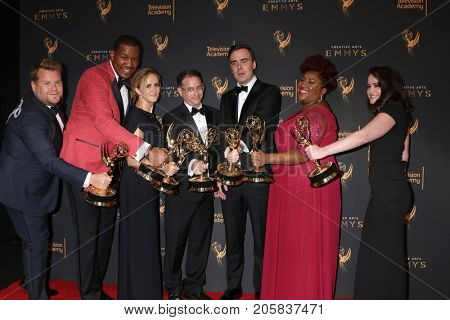 LOS ANGELES - SEP 9:  James Corden photobombing Samantha Bee Show Writing Team at the 2017 Creative Emmy Awards Press Room at the Microsoft Theater on September 9, 2017 in Los Angeles, CA