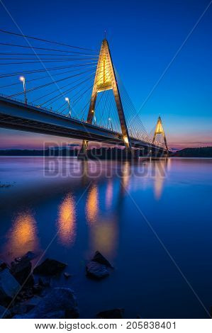 Budapest Hungary - The illuminated Megyeri Bridge over river Danube at blue hour with colorful clear sky