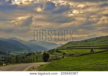 Cycling Mountain Road. Misty Mountain Road In High Mountains. Cloudy Sky With Mountain Road. Azerbai