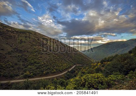Cycling Mountain Road. Misty Mountain Road In High Mountains. Cloudy Sky With Mountain Road. Azerbai