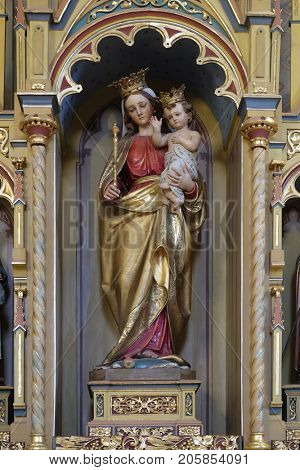 STITAR, CROATIA - NOVEMBER 11: Virgin Mary with baby Jesus statue on altar of Our Lady in the church of Saint Matthew in Stitar, Croatia on November 11, 2016.