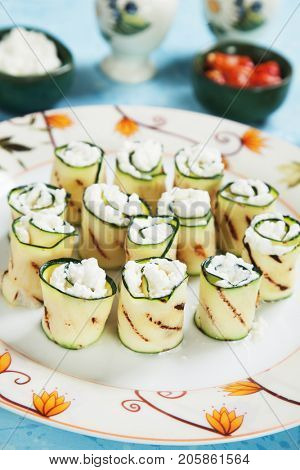 Grilled zucchini rolls filled with fresh cottage cheese
