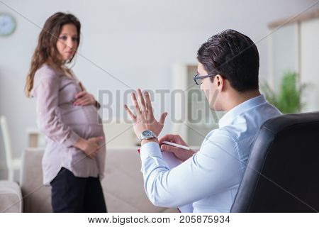 Pregnant woman visiting psychologist doctor