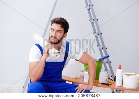 Repairman doing renovation repair in the house with paper wallpa