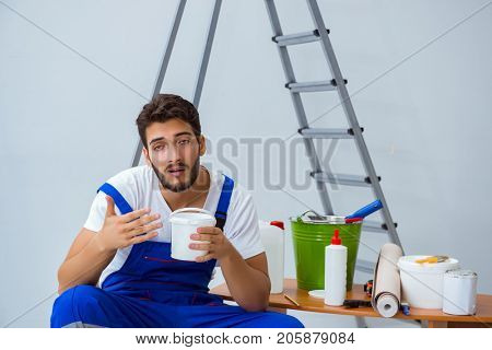 Repairman doing renovation repair in the house with paper wallpa