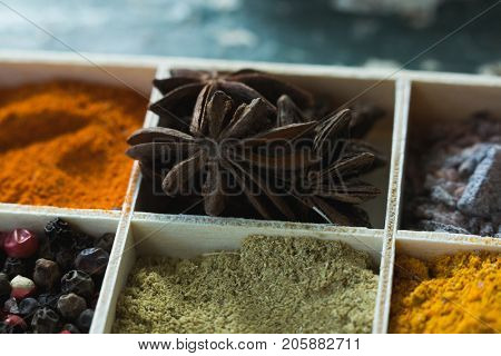 Close-up of various spices arranged in tray