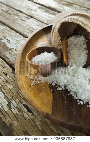 Close-up of sea slat on wooden plate