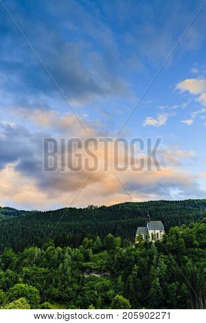 Beautiful sunset view of church in Murau  in Tirol, Austria, Europe