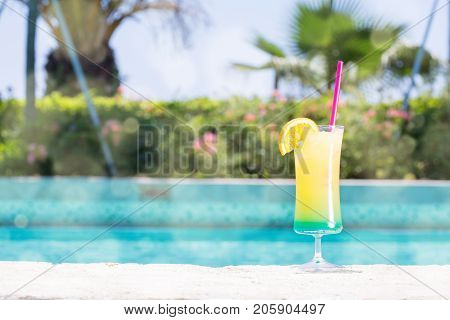 Glass Of Happy Days Cocktail Near The Pool