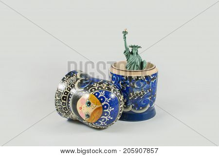 Statue of Liberty inside of Russian nesting doll. USA and Russia relations, cold war, conflict and influence conceptual background