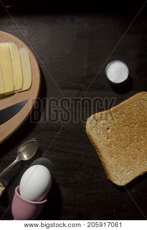 Breakfast option with egg on a black wooden board