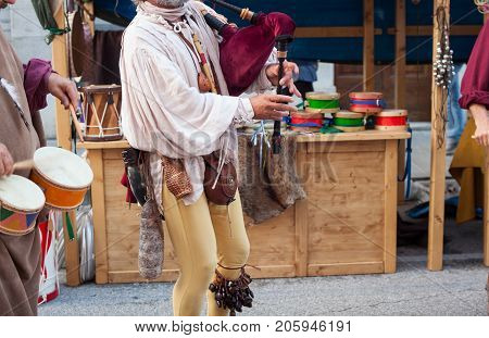 PALMANOVA ITALY - SEPTEMBER 03: Historical bagpiper and drummer dressed in ancient clothes during the historical Reenactment a.d. 1615 on September 03 2017