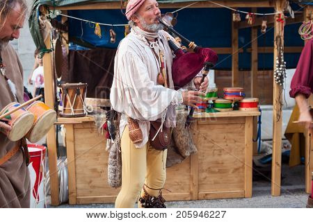 PALMANOVA ITALY - SEPTEMBER 03: Historical bagpiper and drummer dressed in ancient clothes during the historical Reenactment a.d. 1615 on September 03 2017